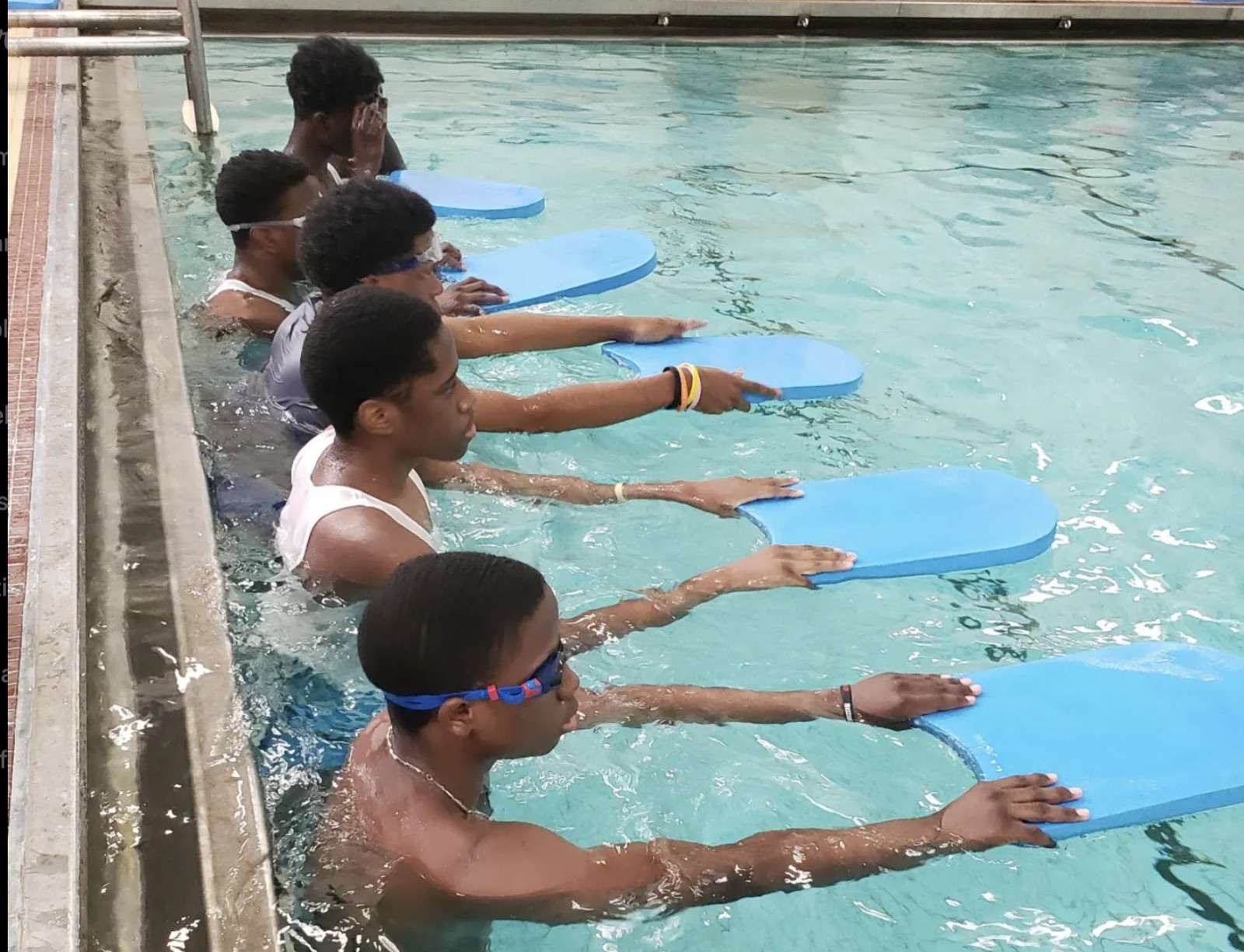 Children learning to swim with MVP Lifeguards instructors.